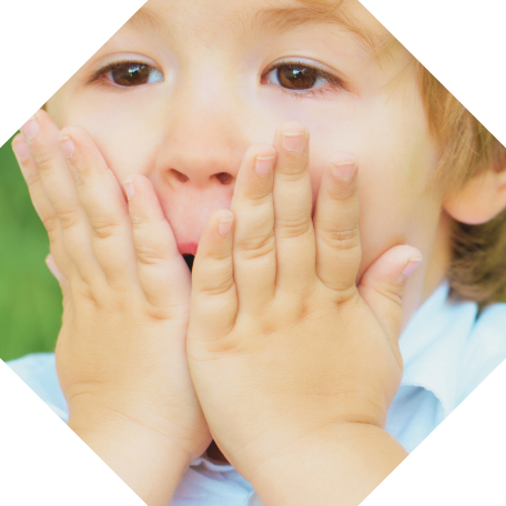 Child holding their face in pain needing pediatric emergency dentist in Aledo